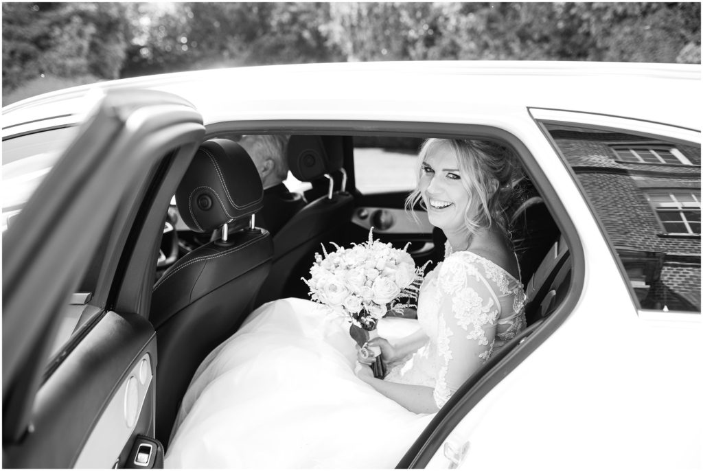 Bride in wedding car