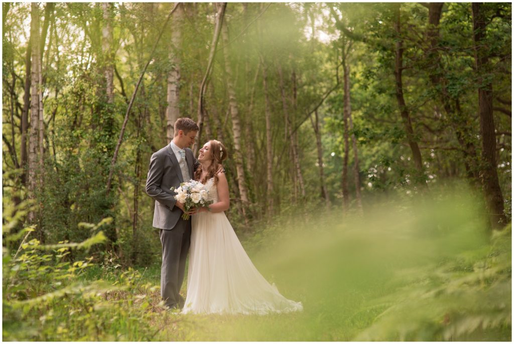 Bride and Groom stood in the Tournerbury Woods